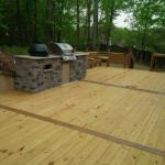 Wood deck, floor design, benches and built in grill area