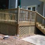 basic wood deck and wood rails with lattice underpinning