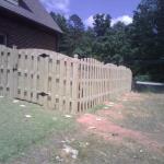 6' Tall Arched Shadow Box Fence on Unleve Ground.