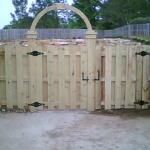 5' Tall Shadow Box Fence with Arch over the walk-thru gate.